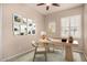 Cozy office with decoratively painted walls, carpet, and a ceiling fan at 2028 S Esmeralda --, Mesa, AZ 85209