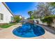 Inviting backyard pool with a basketball hoop, beautiful landscaping, and clear blue water at 2028 S Esmeralda --, Mesa, AZ 85209
