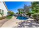 Sparkling backyard pool with a basketball hoop, lush landscaping, and a privacy wall at 2028 S Esmeralda --, Mesa, AZ 85209