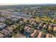 Extensive aerial view of residential neighborhood featuring neatly arranged homes with desert landscaping at 213 E Vaughn Ave, Gilbert, AZ 85234