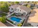 This lovely home includes a gorgeous pool, covered patio, upstairs deck, and well-manicured landscaping at 213 E Vaughn Ave, Gilbert, AZ 85234