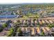Expansive aerial of desert community featuring lush green landscape, community park and well-maintained homes at 213 E Vaughn Ave, Gilbert, AZ 85234