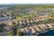 Wonderful aerial view of a community showcasing residential neighborhood, green spaces and a scenic lake at 213 E Vaughn Ave, Gilbert, AZ 85234