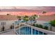 Stunning view overlooking the pool, waterfront, and neighborhood from an upper-level balcony at 213 E Vaughn Ave, Gilbert, AZ 85234