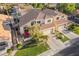Attractive home with three-car garage, tile roof, manicured front lawn, and charming patio area at 213 E Vaughn Ave, Gilbert, AZ 85234