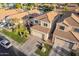 Desirable property featuring a three-car garage, tile roof, manicured front lawn, and pleasant patio at 213 E Vaughn Ave, Gilbert, AZ 85234