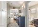 Hallway with tile floors, a blue cabinet, and views to a bedroom and bathroom at 213 E Vaughn Ave, Gilbert, AZ 85234