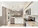 Open-concept kitchen featuring granite countertops, stainless steel appliances, and seamless flow to the living area at 213 E Vaughn Ave, Gilbert, AZ 85234