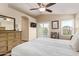 This bedroom features a private balcony, a ceiling fan, and lots of natural light at 213 E Vaughn Ave, Gilbert, AZ 85234