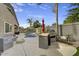 Backyard with a pool, grill area, fire pit, and comfortable seating at 21616 N 82Nd Ln, Peoria, AZ 85382
