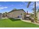 Backyard with grill area and artificial grass at 21616 N 82Nd Ln, Peoria, AZ 85382