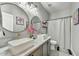 Bright bathroom with double sinks, stylish mirrors, and modern fixtures at 21616 N 82Nd Ln, Peoria, AZ 85382