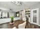 Open concept dining area with views to the living room and a stylish beverage bar at 21616 N 82Nd Ln, Peoria, AZ 85382