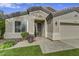 Charming single-story home with a well-manicured lawn, desert landscaping, and a two-car garage at 21616 N 82Nd Ln, Peoria, AZ 85382