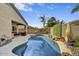 Backyard pool featuring rock accents, stylish surfboards, and a comfortable seating area at 21616 N 82Nd Ln, Peoria, AZ 85382