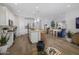Bright, spacious kitchen with stainless steel appliances, a center island, and an open dining area at 22360 W Monona Ln, Surprise, AZ 85387