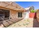 View of backyard with covered patio and red wood fence at 2455 E Broadway Rd # 39, Mesa, AZ 85204
