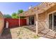 Backyard with covered patio. Includes grass yard and wood fence at 2455 E Broadway Rd # 39, Mesa, AZ 85204