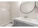 Well-lit bathroom boasts a modern sink, mirror, and shower-tub combo at 2455 E Broadway Rd # 39, Mesa, AZ 85204