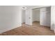 Bedroom with wood floors, closet with mirrored doors, and white walls at 2455 E Broadway Rd # 39, Mesa, AZ 85204