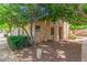 Charming townhouse exterior with mature trees providing shade and privacy, enhancing the inviting atmosphere at 2455 E Broadway Rd # 39, Mesa, AZ 85204