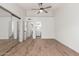 Open bedroom with wood-look flooring and access to the bathroom at 2455 E Broadway Rd # 39, Mesa, AZ 85204
