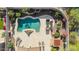 Bird's-eye view of a modern backyard featuring a sparkling pool, a spa, and a spacious patio with seating at 2674 N Saide Ln, Buckeye, AZ 85396