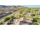 Desirable home with pool and patio, surrounded by lush desert landscaping with mountain views at 2674 N Saide Ln, Buckeye, AZ 85396