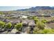 Charming home in a desirable community, featuring a well-maintained lawn and beautiful mountain backdrop at 2674 N Saide Ln, Buckeye, AZ 85396