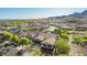 Expansive aerial view of a residential community with well-maintained homes and desert landscaping at 2674 N Saide Ln, Buckeye, AZ 85396