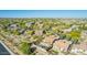 Stunning aerial view of a neighborhood showcasing lush green landscaping and backyard pools at 2674 N Saide Ln, Buckeye, AZ 85396