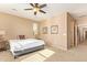 Bedroom with carpet floors, natural light from the windows, and a ceiling fan at 2674 N Saide Ln, Buckeye, AZ 85396