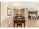 Spacious dining area featuring tiled floors, connecting to the kitchen, and room for large gatherings at 2674 N Saide Ln, Buckeye, AZ 85396