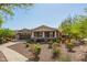 Inviting single-Gathering home with a covered front porch, desert landscaping, and an attached two-car garage at 2674 N Saide Ln, Buckeye, AZ 85396