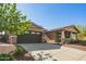Charming single-story home featuring a two-car garage, covered porch, and low-maintenance landscaping at 2674 N Saide Ln, Buckeye, AZ 85396