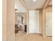 Welcoming hallway entrance featuring tile flooring, neutral paint and a view to the living area at 2674 N Saide Ln, Buckeye, AZ 85396