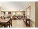 Inviting living room features tile floors, comfortable seating, and an open floor plan with views into kitchen at 2674 N Saide Ln, Buckeye, AZ 85396
