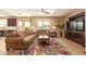 Comfortable living room with plush sofas, bright windows, and a view to the patio at 2674 N Saide Ln, Buckeye, AZ 85396