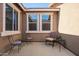Cozy covered patio area with comfortable seating, perfect for relaxing and enjoying the outdoor ambiance at 2674 N Saide Ln, Buckeye, AZ 85396