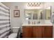 A modern bathroom with a single sink vanity, framed mirror, and a shower/tub combo at 280 S Evergreen Rd # 1320, Tempe, AZ 85288