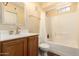 Bathroom featuring a single sink vanity, framed mirror, and a shower/tub combo at 280 S Evergreen Rd # 1320, Tempe, AZ 85288