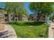 Community green space in townhome complex with sidewalk and parking at 280 S Evergreen Rd # 1320, Tempe, AZ 85288