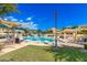 A community pool offers shaded seating and lounge chairs for residents to enjoy outdoor relaxation at 280 S Evergreen Rd # 1320, Tempe, AZ 85288