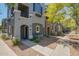Attractive townhome featuring a well-maintained gray exterior, private balcony and low-maintenance desert landscaping at 280 S Evergreen Rd # 1320, Tempe, AZ 85288