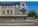 A modern townhome with gray exterior paint, gray shutters, and a two-car garage at 280 S Evergreen Rd # 1320, Tempe, AZ 85288