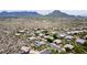 Aerial view of the community, showcasing lush desert landscaping and mountain views at 28019 N 115 Pl, Scottsdale, AZ 85262