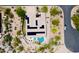 Aerial view of a desert home featuring solar panels, heart-shaped pool, and beautifully landscaped surroundings at 28019 N 115 Pl, Scottsdale, AZ 85262
