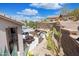 Backyard patio area with grill, outdoor seating, and desert landscaping at 28019 N 115 Pl, Scottsdale, AZ 85262