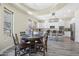 Breakfast nook with a round wooden table, seating six, with white cabinets at 28019 N 115 Pl, Scottsdale, AZ 85262