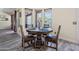 Bright breakfast nook featuring rustic table, seating for four, and natural light at 28019 N 115 Pl, Scottsdale, AZ 85262